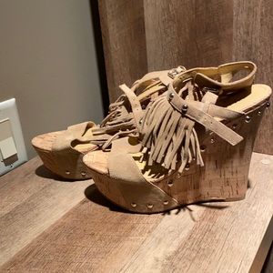Tan fringe wedges with fringe. Never wore them
